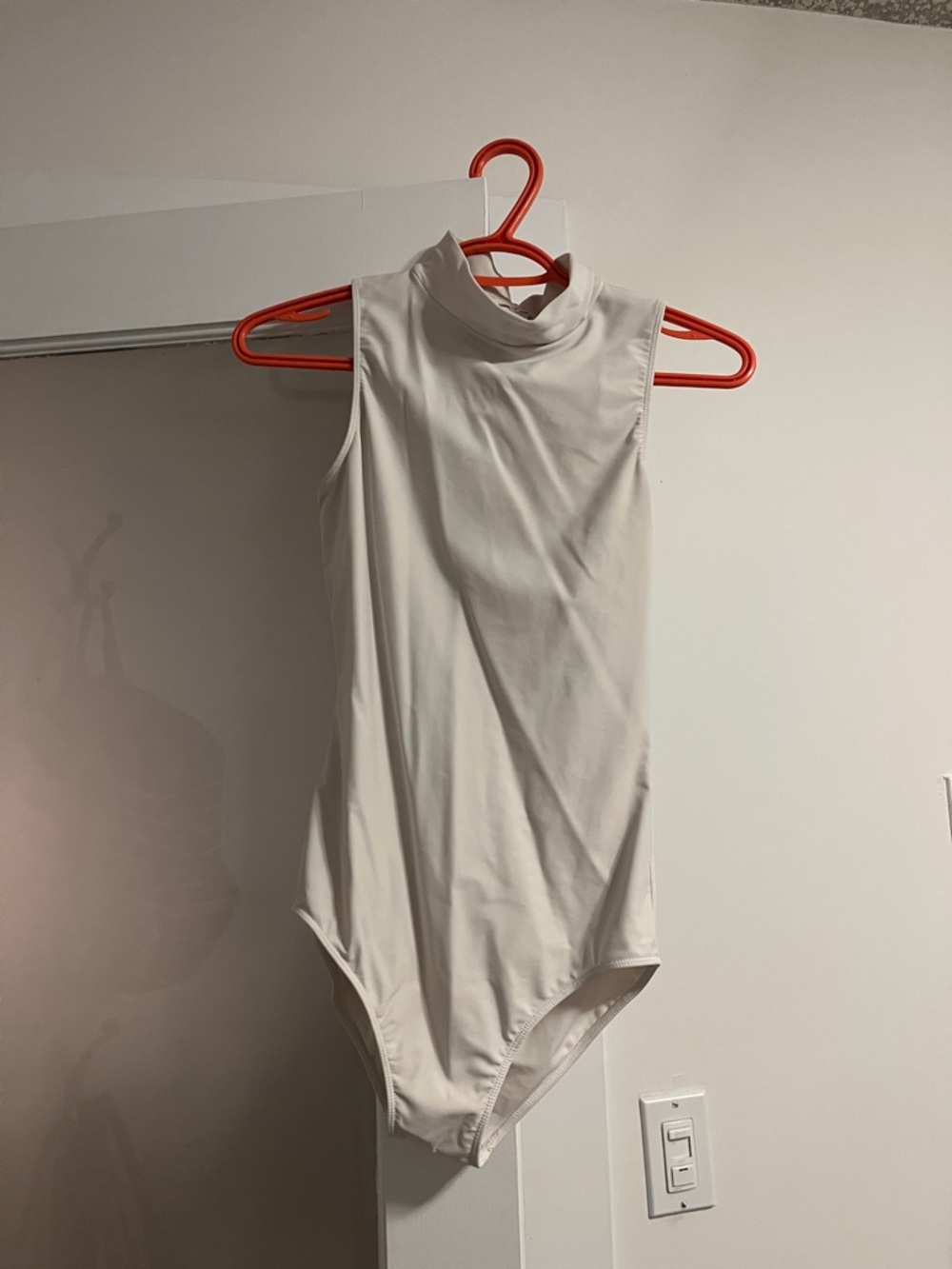 Sleeveless High Neck White Bodysuit
